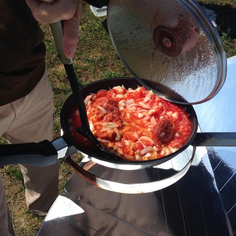 снимка на Dishes with a solar cooker